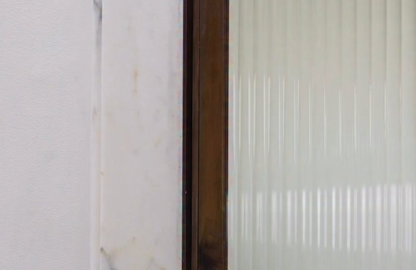 Brass door hardware with reeded glass