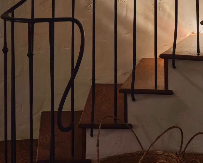 Iron staircase with plaster walls