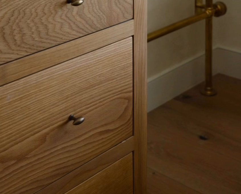 Vanity with brass towel warmer