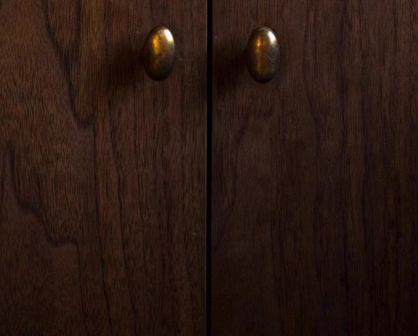 Oak cabinets with brass knobs
